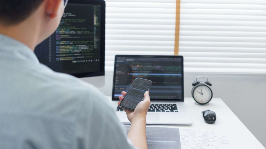 software-development-concept-male-programmer-check-H8N29XU